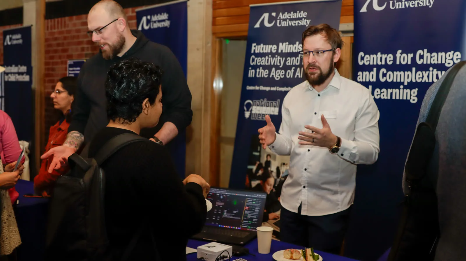 Andrew Zamecnik demonstrating the magpies at the C3L stall, EBSS Research Centres Showcase, Union House
